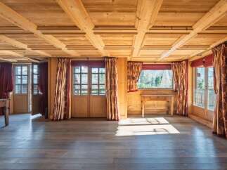 Step into a world of rustic charm with this stunning property, showcasing exquisite wooden ceilings and floors that exude warmth and character.