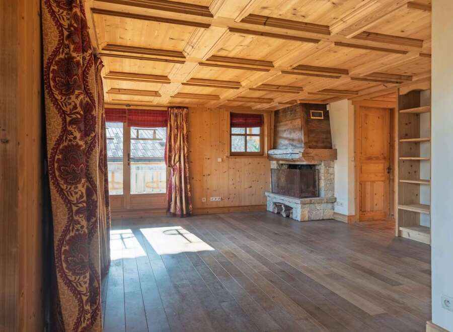Step into a world of rustic charm with this stunning property, featuring a beautifully crafted wooden ceiling and warm wooden floors.