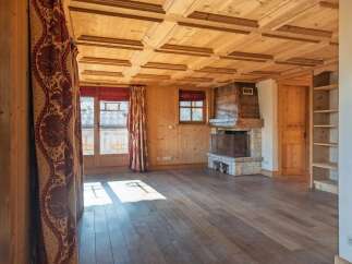 Step into a world of rustic charm with this stunning property, featuring a beautifully crafted wooden ceiling and warm wooden floors.