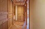 Step into a world of rustic charm with this inviting hallway.