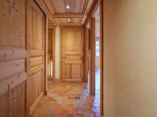 Step into a world of rustic charm with this inviting hallway.