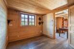 Step into this charming, wood-paneled room, perfect for a cozy retreat.