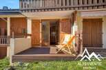 Discover the charm of this stunning property, featuring a beautifully designed wooden deck and inviting outdoor seating.