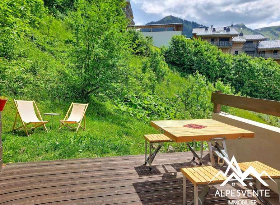 Enjoy the serene mountain views from this charming property's outdoor seating area.