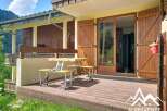 Enjoy outdoor living on this charming wooden deck, perfect for al fresco dining or relaxing with a view.