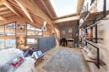 Experience the charm of this stunning property, featuring a cozy living area with a plush rug and a comfortable sofa.