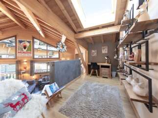 Experience the charm of this stunning property, featuring a cozy living area with a plush rug and a comfortable sofa.