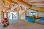 This stunning property boasts a unique architectural design with exposed wooden beams and a cozy, inviting atmosphere.