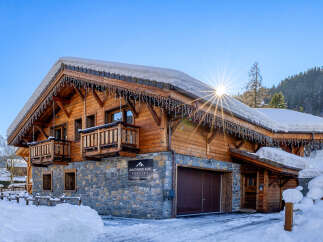 Discover the charm of this stunning chalet nestled in a winter wonderland.
