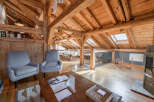 Experience the charm of this stunning property, featuring a beautifully designed interior with exposed wooden beams and a cozy ambiance.