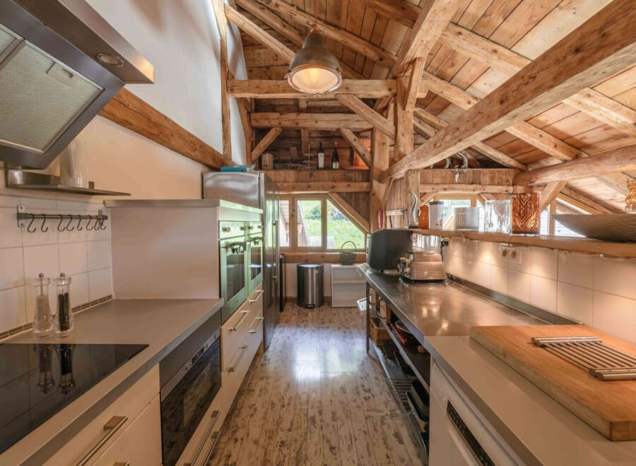 This stunning kitchen showcases a unique blend of rustic charm and modern design.