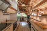 This stunning kitchen showcases a unique blend of rustic charm and modern design.