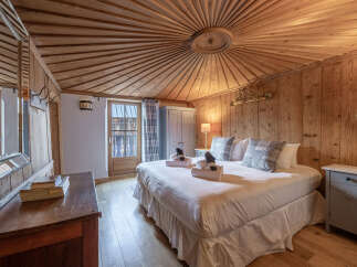 Experience the rustic charm of this beautifully designed bedroom.
