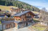 Discover the charm of this stunning wooden chalet nestled in a picturesque mountain setting.