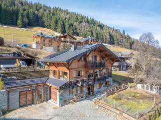 Discover the charm of this stunning wooden chalet nestled in a picturesque mountain setting.