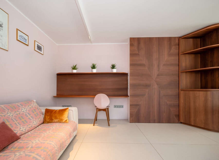 This stunning property boasts a modern interior with elegant wooden accents.