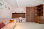 This stunning property boasts a modern interior with elegant wooden accents.
