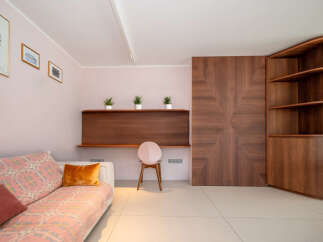 This stunning property boasts a modern interior with elegant wooden accents.