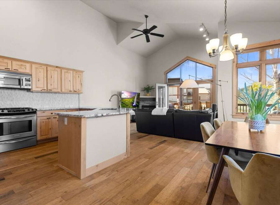 This stunning property boasts a modern kitchen with stainless steel appliances and ample cabinet space, perfect for culinary enthusiasts.