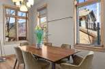This stunning dining room boasts a warm and inviting atmosphere, perfect for hosting gatherings.