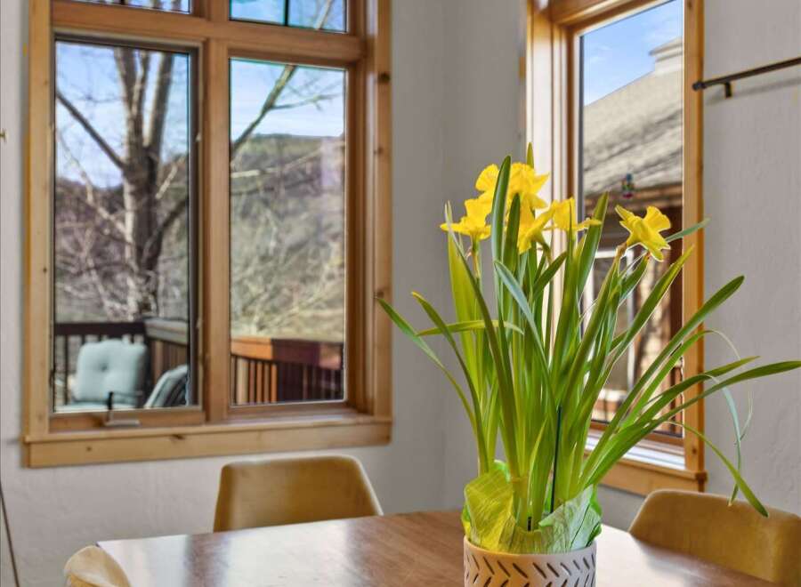 This stunning dining room boasts natural light and elegant design.