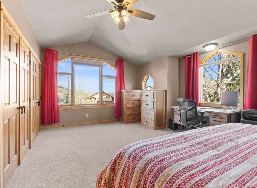 Step into this inviting bedroom, featuring a spacious layout and abundant natural light.