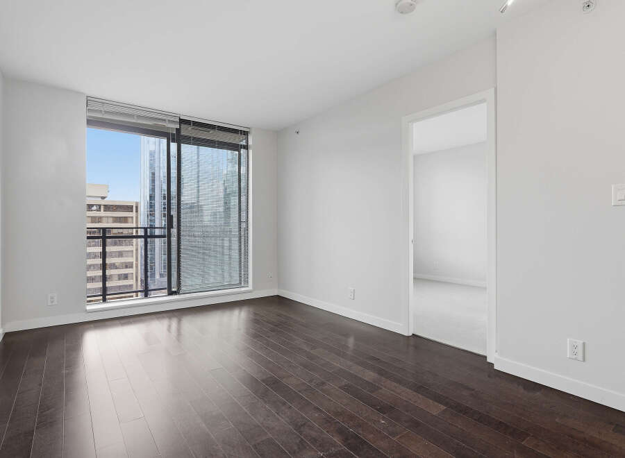 This stunning condo boasts a modern design with sleek hardwood floors and expansive windows offering breathtaking city views.