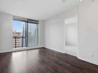 This stunning condo boasts a modern design with sleek hardwood floors and expansive windows offering breathtaking city views.
