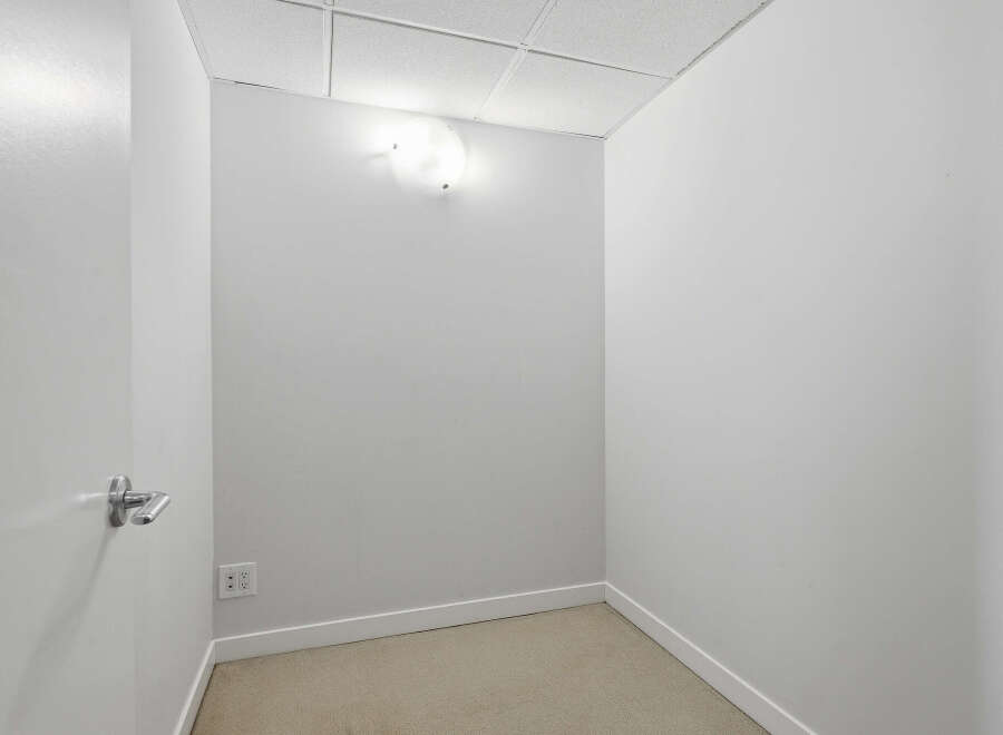 Step into this bright and airy space, perfect for a home office or a cozy reading nook.