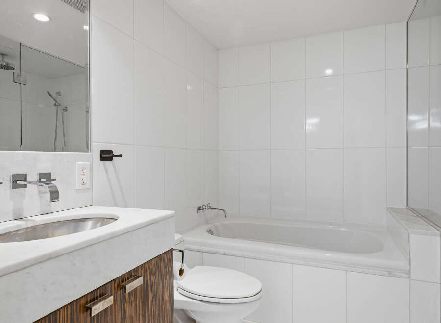 This modern bathroom features a sleek design with clean lines and a minimalist aesthetic.
