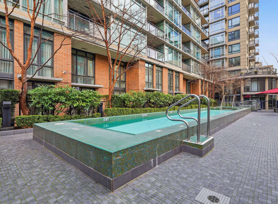 Discover luxury living at its finest with this stunning property featuring a refreshing outdoor pool.