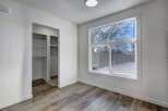 Step into this bright and airy room, featuring a large window that floods the space with natural light.
