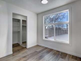Step into this bright and airy room, featuring a large window that floods the space with natural light.