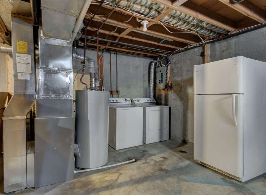 This utility room offers a practical space with essential appliances.