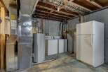 This utility room offers a practical space with essential appliances.