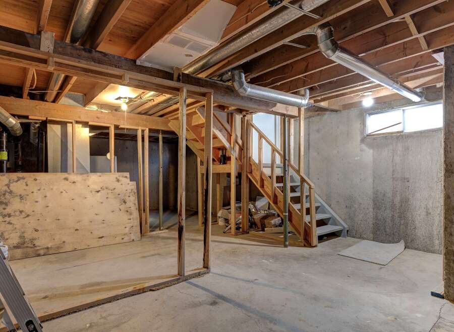 Explore the potential of this unfinished basement, perfect for customization.