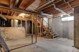 Explore the potential of this unfinished basement, perfect for customization.
