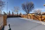 Enjoy the tranquility of this spacious backyard, perfect for outdoor activities.