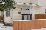 This charming property features a welcoming facade with a well-maintained exterior.