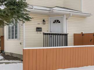 This charming property features a welcoming facade with a well-maintained exterior.