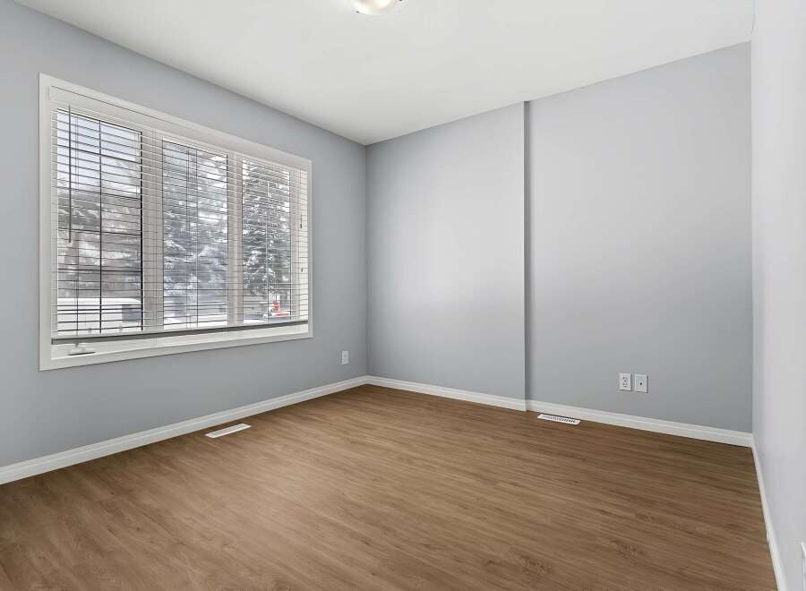 This inviting room features a neutral color palette, creating a versatile space ready for personalization.