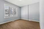 This inviting room features a neutral color palette, creating a versatile space ready for personalization.