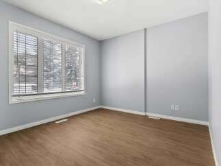 This inviting room features a neutral color palette, creating a versatile space ready for personalization.