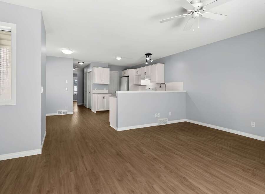 Step into this inviting home featuring a bright and open floor plan with a modern kitchen.