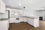 This stunning kitchen boasts bright white cabinetry, offering a clean and modern aesthetic.