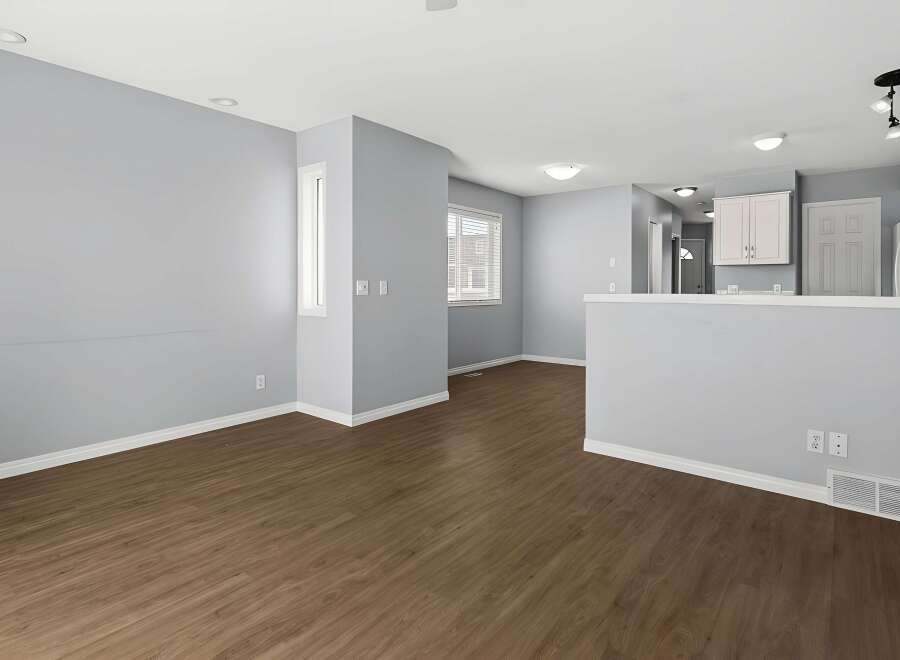 Step into this inviting living space, featuring a modern design and ample natural light.