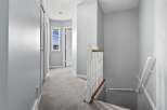This stunning property features a bright and airy hallway with a staircase.