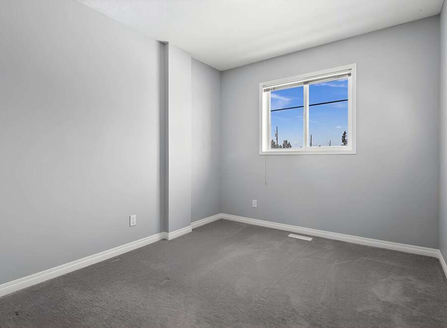 This inviting room features a neutral color palette, creating a versatile space ready for your personal touch.
