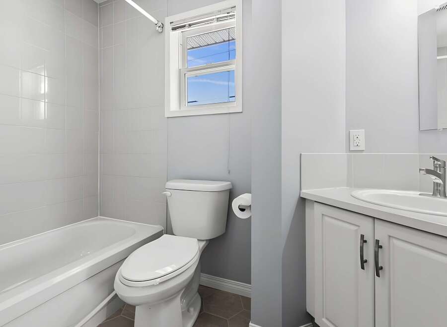 This bathroom features a clean and modern design with a neutral color palette.