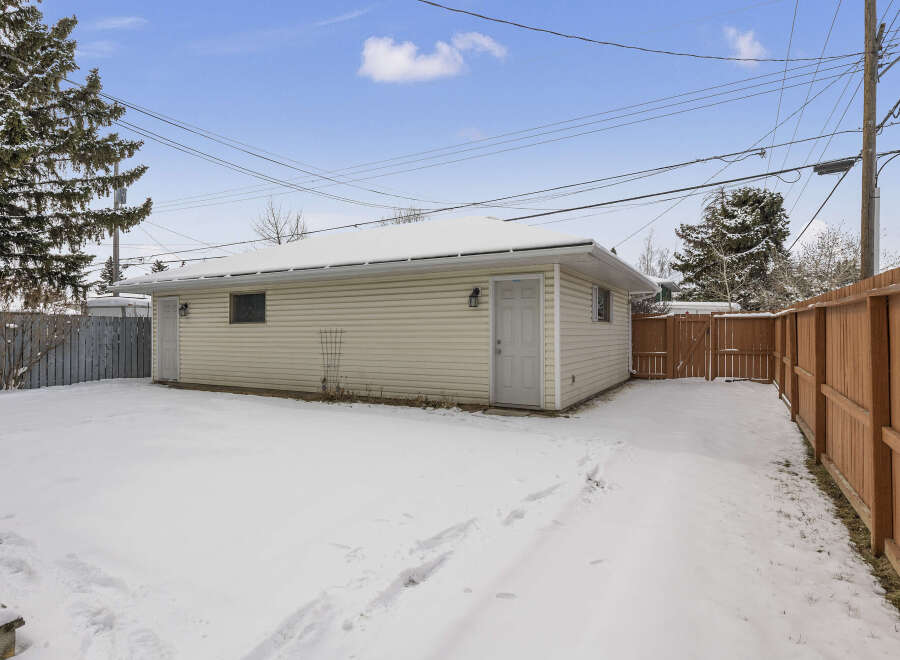 This property features a detached garage, perfect for parking or extra storage.